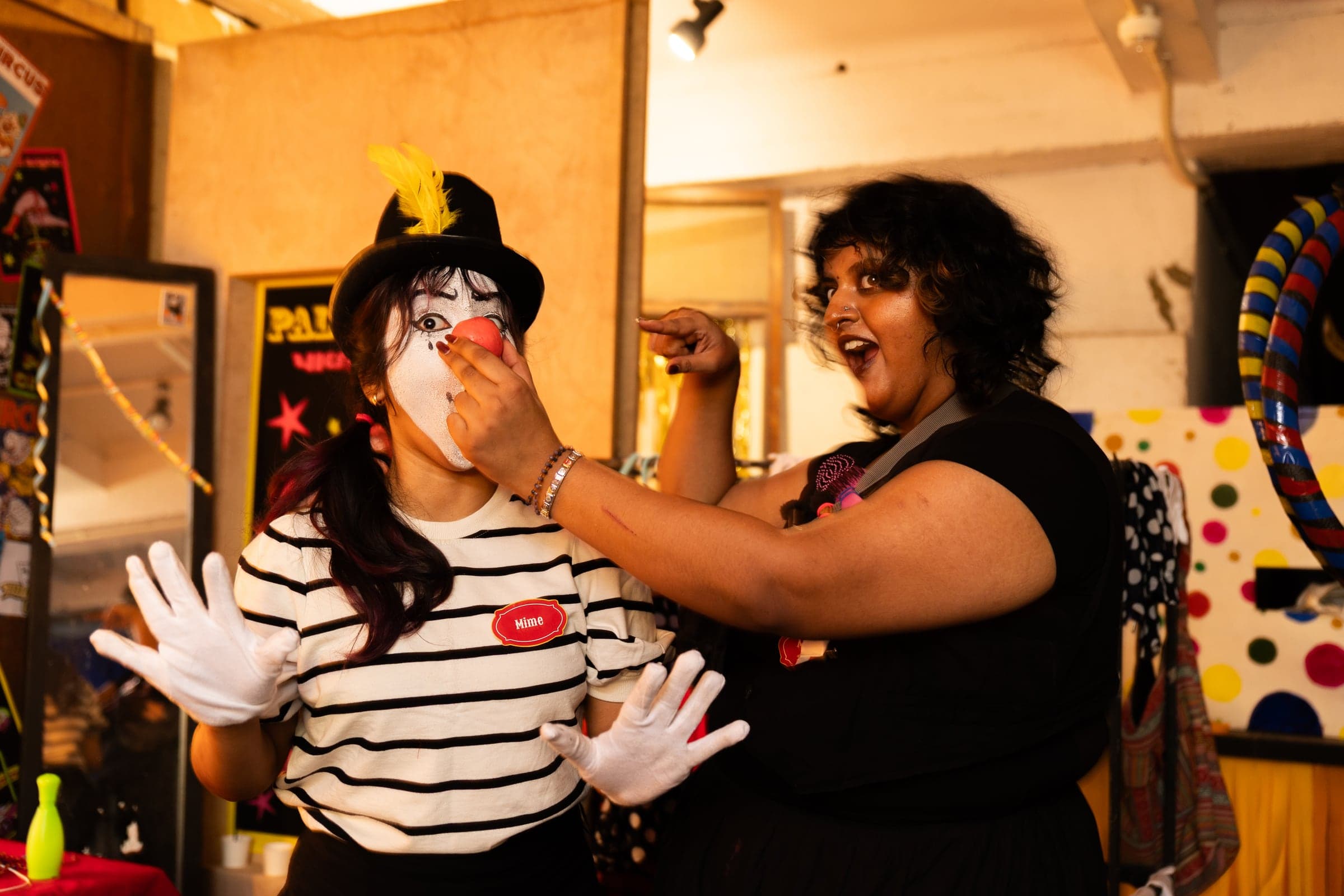 Performers assembled within the immersive set