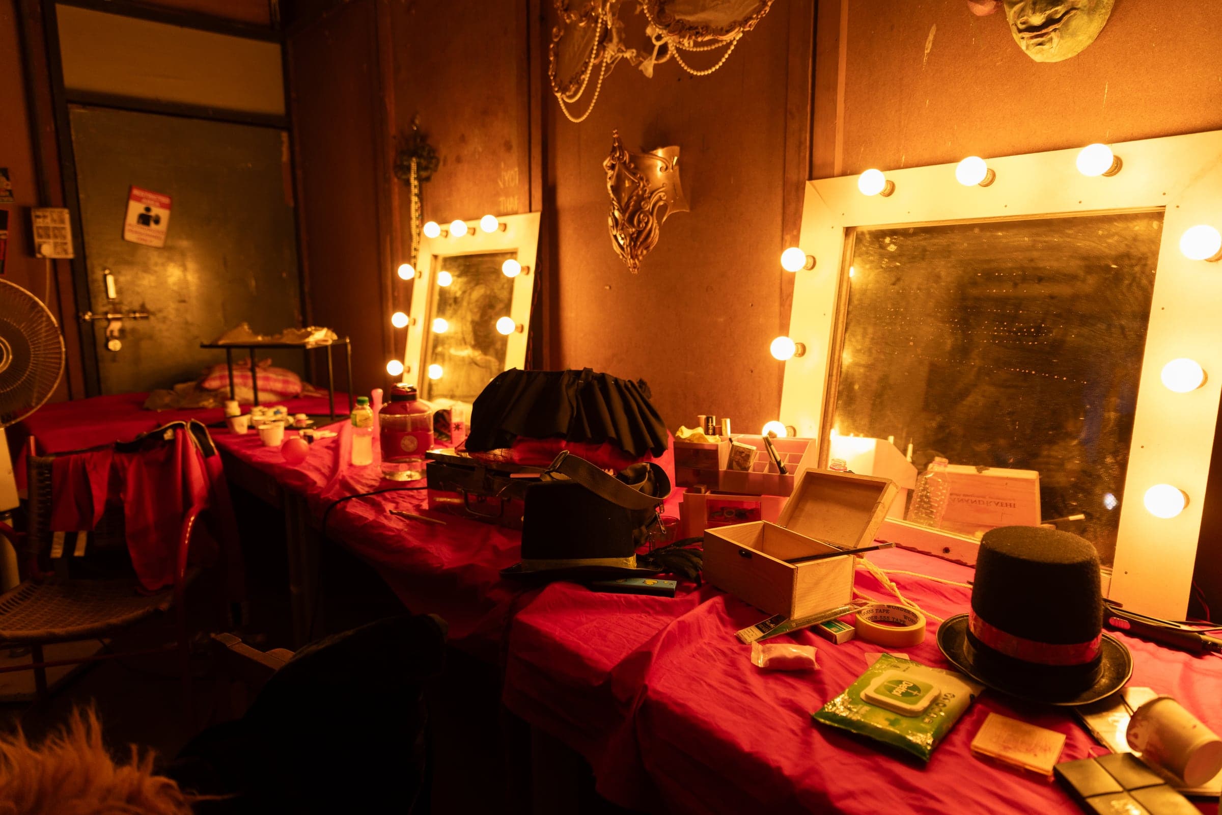 Circus posters and props extending the theatrical fiction