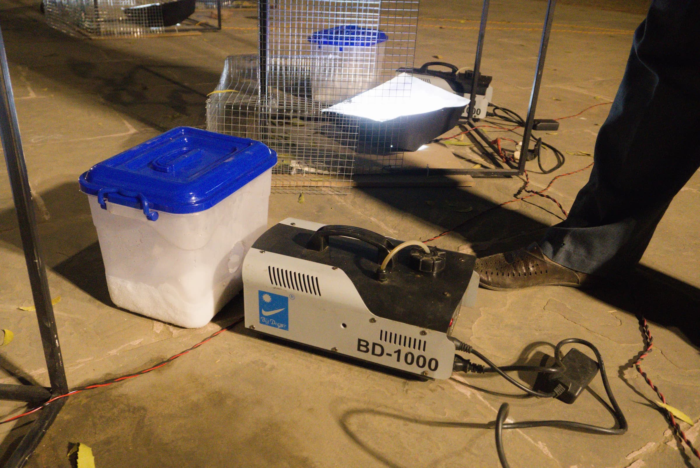 Fog equipment and cables beside the stage