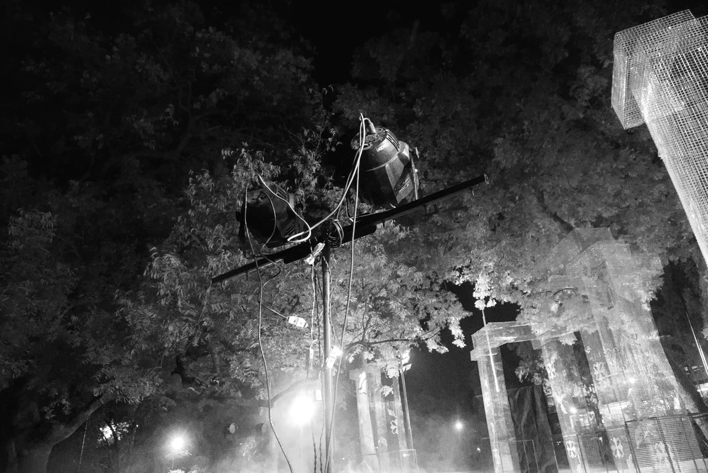 Black-and-white view of the outdoor set surrounded by fog and trees