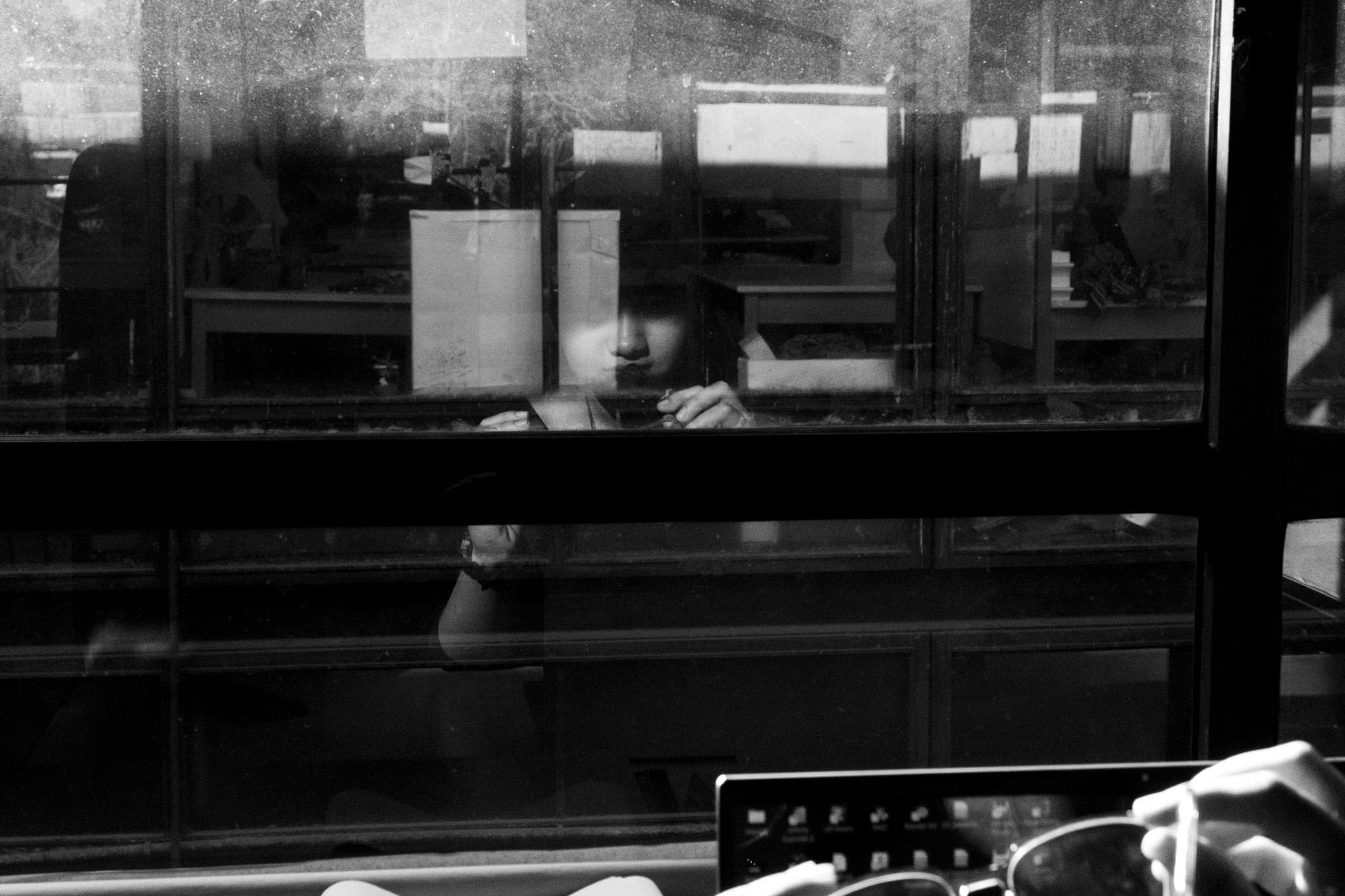 A face reflected in the window
