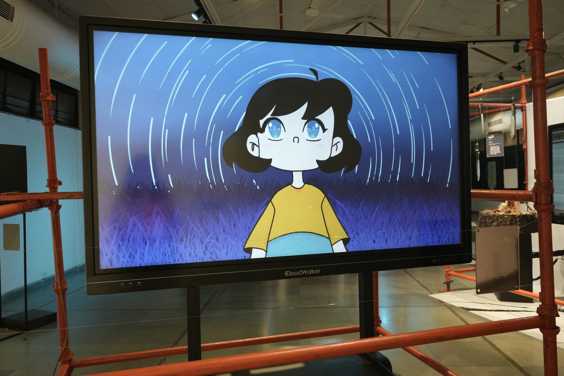Animated moving-image work shown on a large screen
