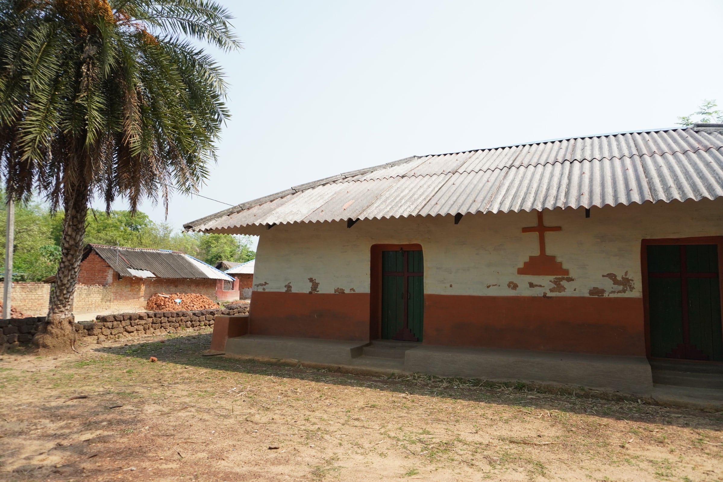 Painted house and shaded courtyard