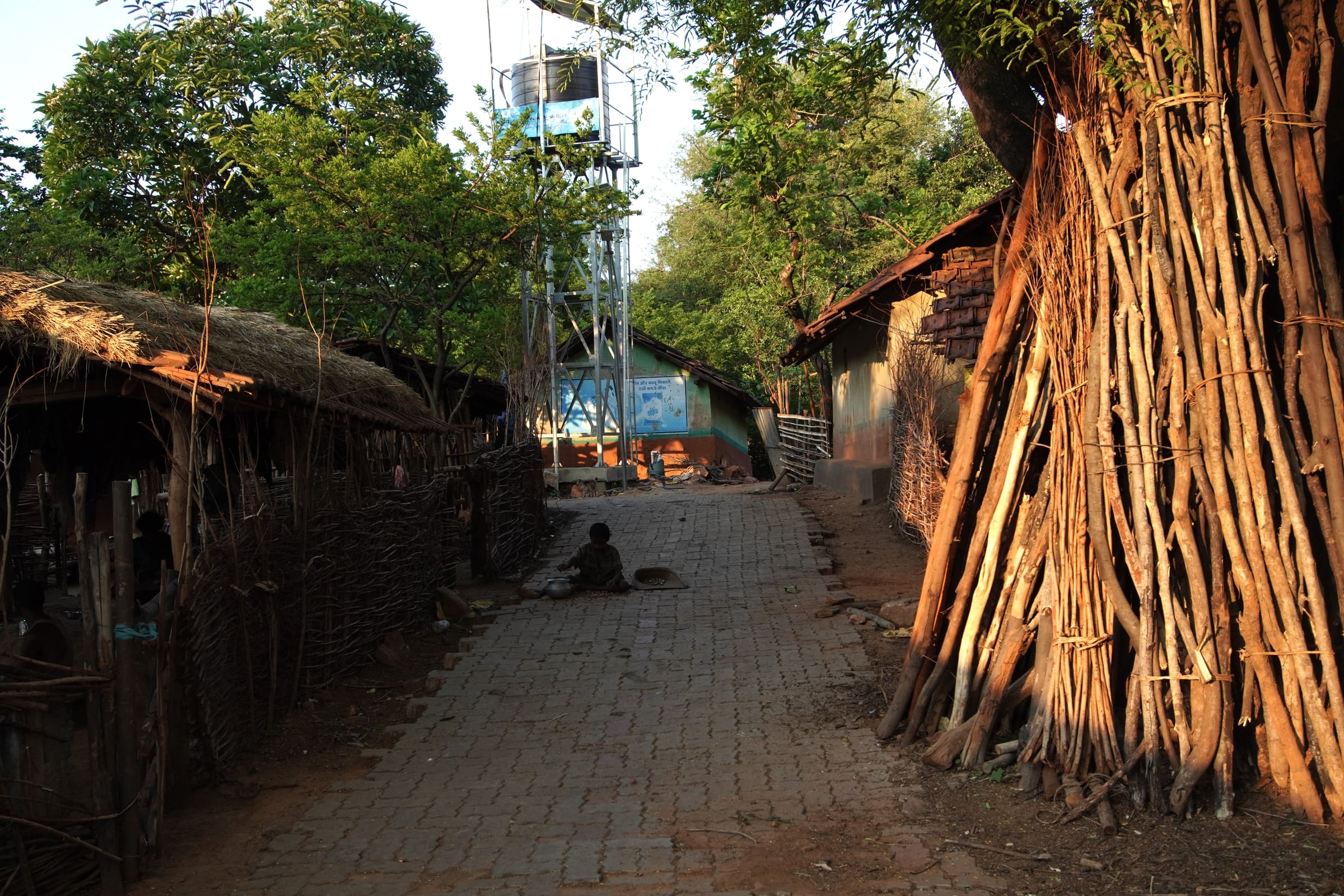 Materials stacked along a village lane