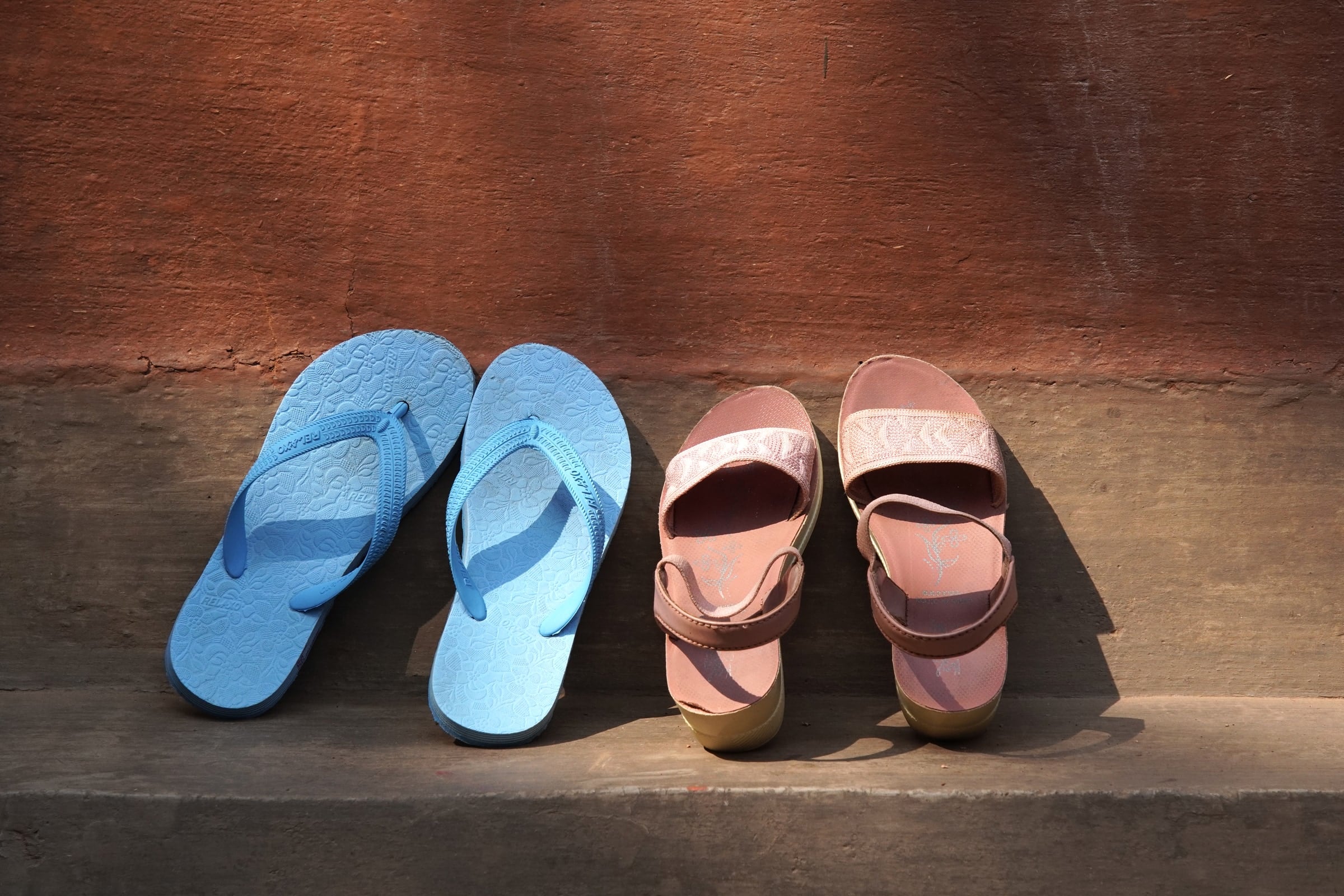 Footwear beside a doorway