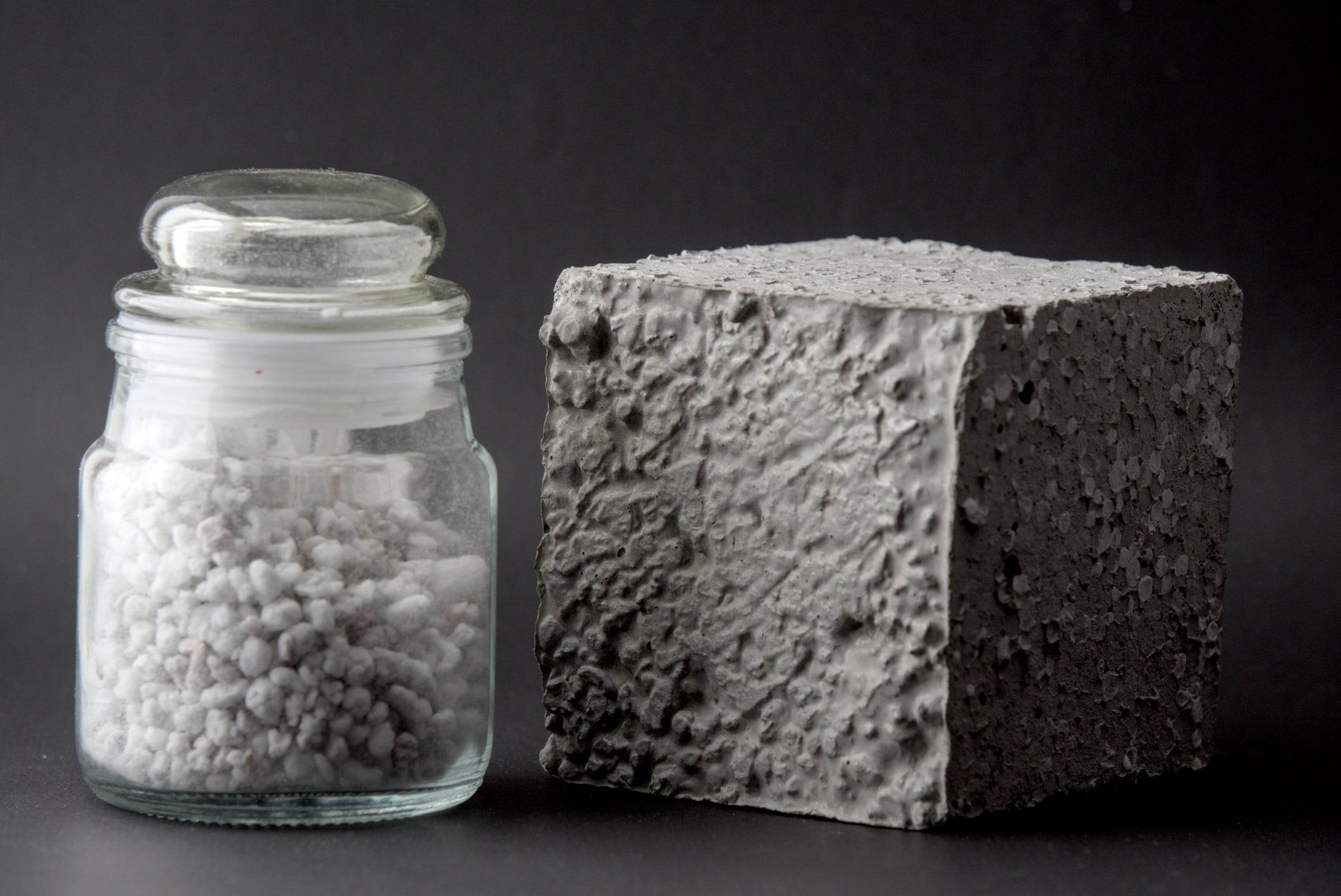 Aggregate sample displayed beside a porous concrete test block