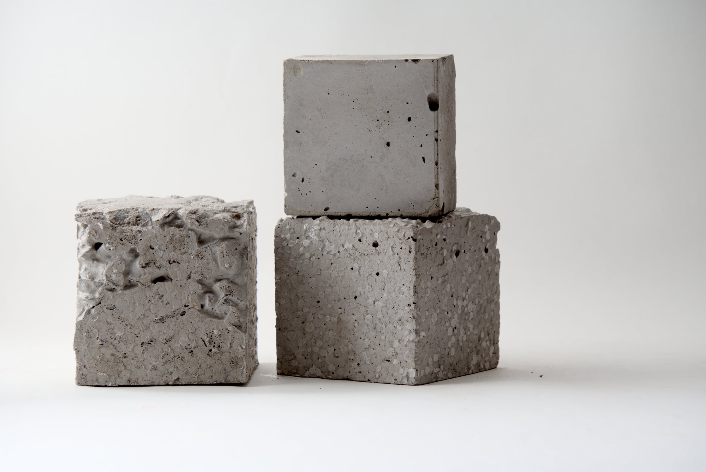 Three concrete samples with different densities and surface finishes