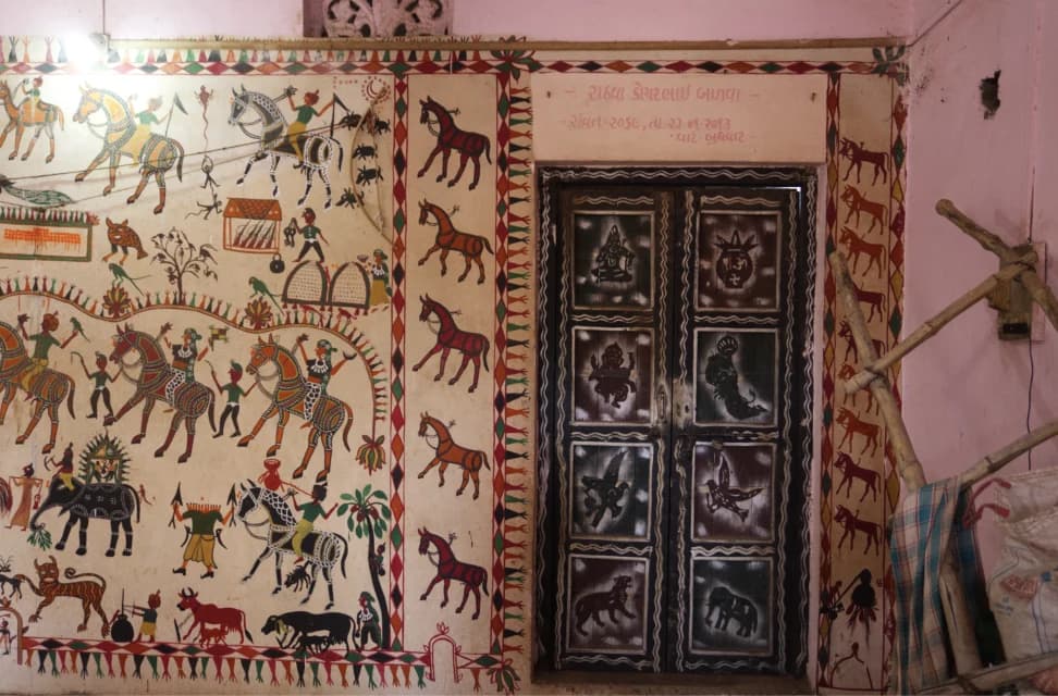 Pithora painting in the house of a local village shaman. The painting is not just a painting but a tool to narrate the story of the community, Tejgadh, Gujarat.